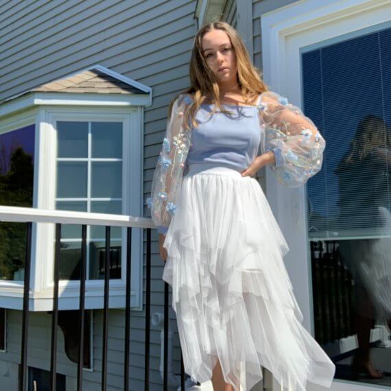 Light blue square neck bodice with long floral overlay sleeves, white midi tule skirt with layered lengths