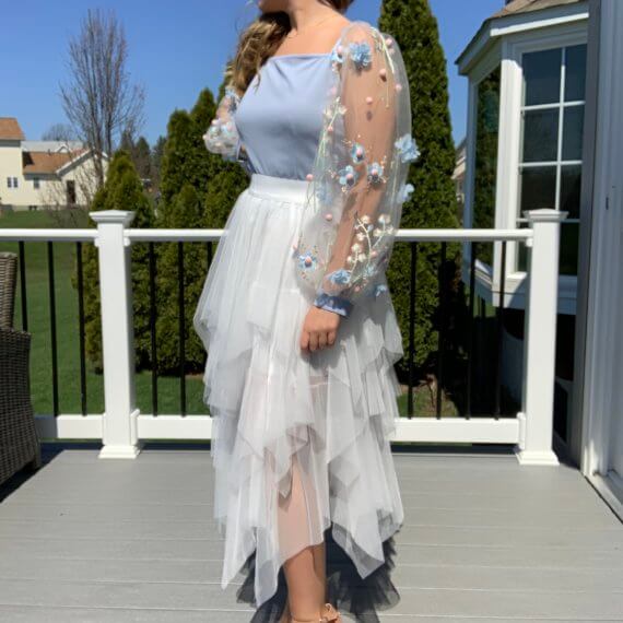 Light blue square neck bodice with long floral overlay sleeves, white midi tule skirt with layered lengths