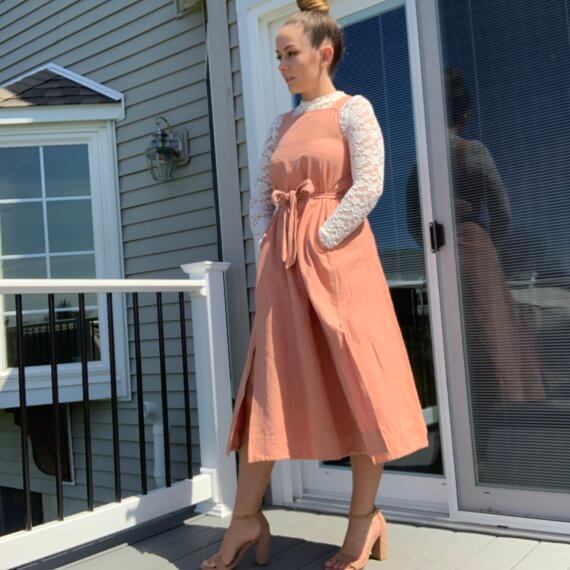 Pastel pink midi dress with square neckline, double slit skirt with lace mock-neck long sleeve underlay.