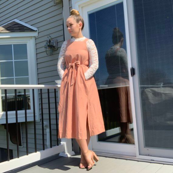 Pastel pink midi dress with square neckline, double slit skirt with lace mock-neck long sleeve underlay.