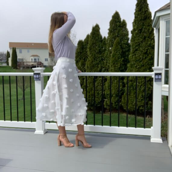 Pastel purple sweater with lace peter-pan collar, midi white a-line skirt with puff details