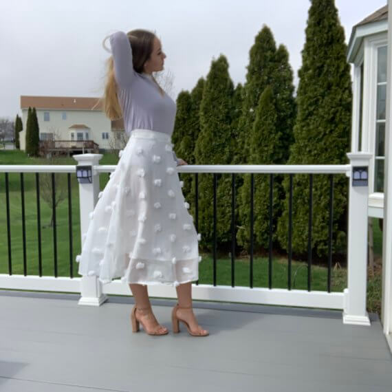 Pastel purple sweater with lace peter-pan collar, midi white a-line skirt with puff details