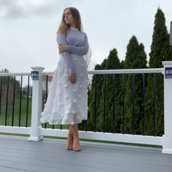 Pastel purple sweater with lace peter-pan collar, midi white a-line skirt with puff details