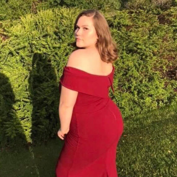 Off the shoulder fire engine red prom gown.