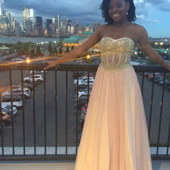 Pink and gold strapless prom gown with a sweetheart neckline and is floor length. Gold lace jeweled bust with pink boning.