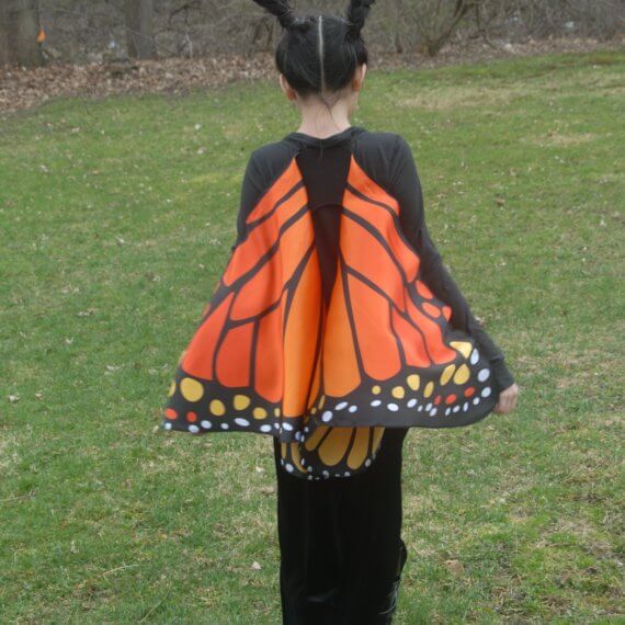 Look #5 Monarch Butterfly in The Backyard Stylist: Chie Kai Outfit: Monarch butterfly cape wings, Long velour skirt, Long black sleeve Shoes: Personal Collection Accessories: Personal Collection Model: Anina Pabros Photographer: Ed Pabros Location: Le Roy, NY