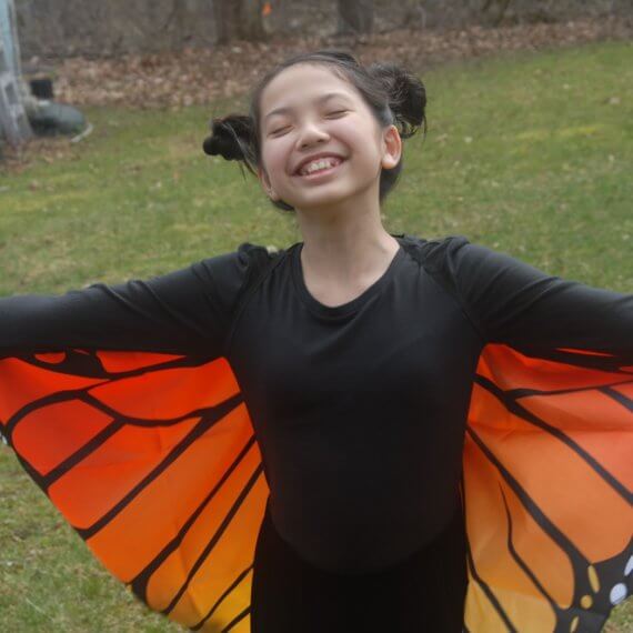 Look #5 Monarch Butterfly in The Backyard Stylist: Chie Kai Outfit: Monarch butterfly cape wings, Long velour skirt, Long black sleeve Shoes: Personal Collection Accessories: Personal Collection Model: Anina Pabros Photographer: Ed Pabros Location: Le Roy, NY