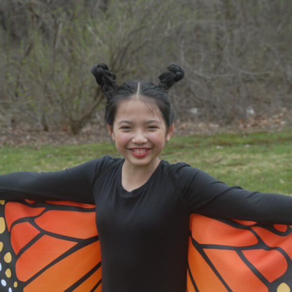 Look #5 Monarch Butterfly in The Backyard Stylist: Chie Kai Outfit: Monarch butterfly cape wings, Long velour skirt, Long black sleeve Shoes: Personal Collection Accessories: Personal Collection Model: Anina Pabros Photographer: Ed Pabros Location: Le Roy, NY
