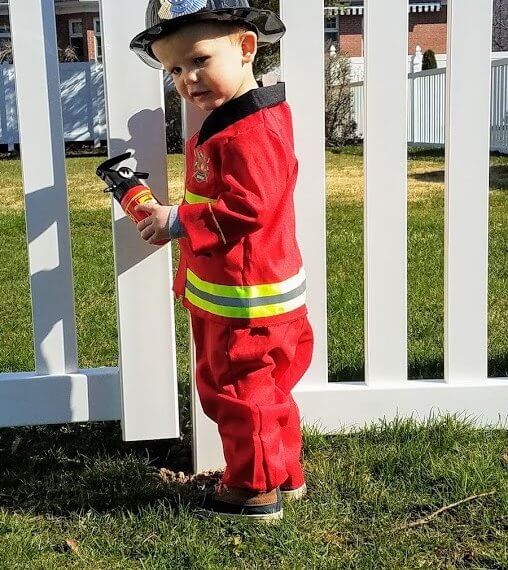 Look #2 A Little Hero Stylist: Chie Kai Outfits: F ireman costume Shoes: Personal Collection Accessories: Personal Collection Model: Collin Masters Photographer: Amy Masters Location: Batavia, NY