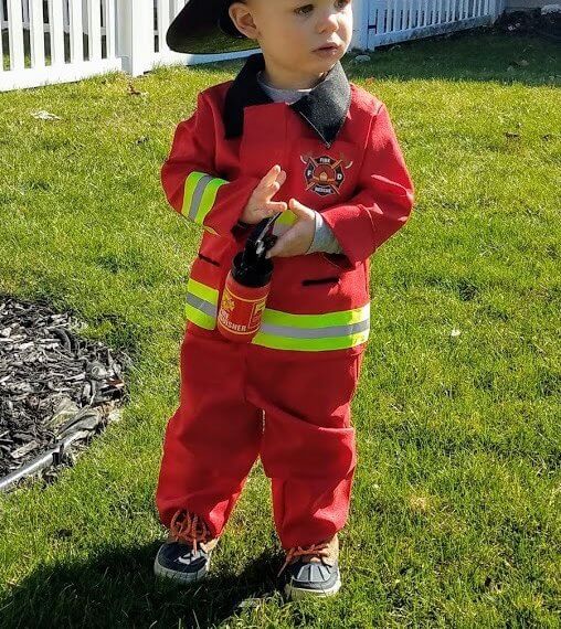 Look #2 A Little Hero Stylist: Chie Kai Outfits: F ireman costume Shoes: Personal Collection Accessories: Personal Collection Model: Collin Masters Photographer: Amy Masters Location: Batavia, NY