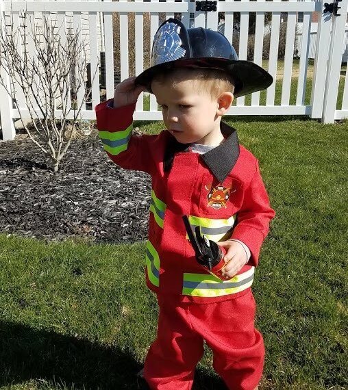 Look #2 A Little Hero Stylist: Chie Kai Outfits: F ireman costume Shoes: Personal Collection Accessories: Personal Collection Model: Collin Masters Photographer: Amy Masters Location: Batavia, NY