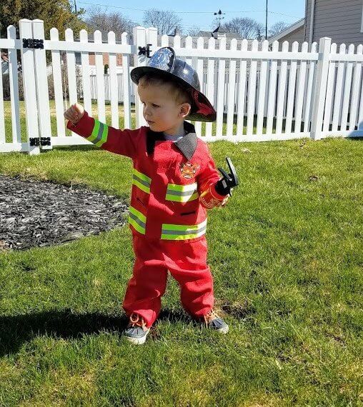 Look #2 A Little Hero Stylist: Chie Kai Outfits: F ireman costume Shoes: Personal Collection Accessories: Personal Collection Model: Collin Masters Photographer: Amy Masters Location: Batavia, NY