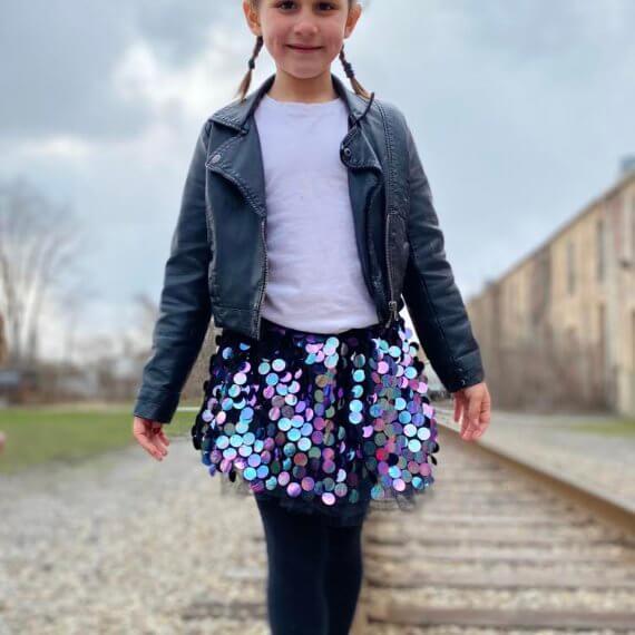 Look #7 Playful Glitter Stylist: Chie Kai Outfit: Mini spangle skirt, White shirtLeather jacket Shoes: Personal Collection Model: Evelyn Mager Photographer: Krysia Mager Location: Batavia, NY