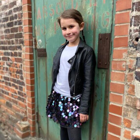 Look #7 Playful Glitter Stylist: Chie Kai Outfit: Mini spangle skirt, White shirtLeather jacket Shoes: Personal Collection Model: Evelyn Mager Photographer: Krysia Mager Location: Batavia, NY