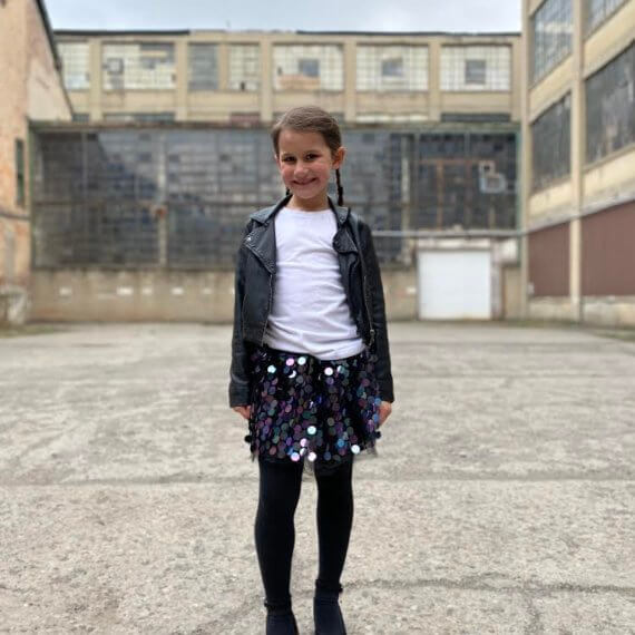 Look #7 Playful Glitter Stylist: Chie Kai Outfit: Mini spangle skirt, White shirtLeather jacket Shoes: Personal Collection Model: Evelyn Mager Photographer: Krysia Mager Location: Batavia, NY