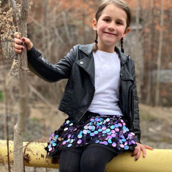 Look #7 Playful Glitter Stylist: Chie Kai Outfit: Mini spangle skirt, White shirtLeather jacket Shoes: Personal Collection Model: Evelyn Mager Photographer: Krysia Mager Location: Batavia, NY