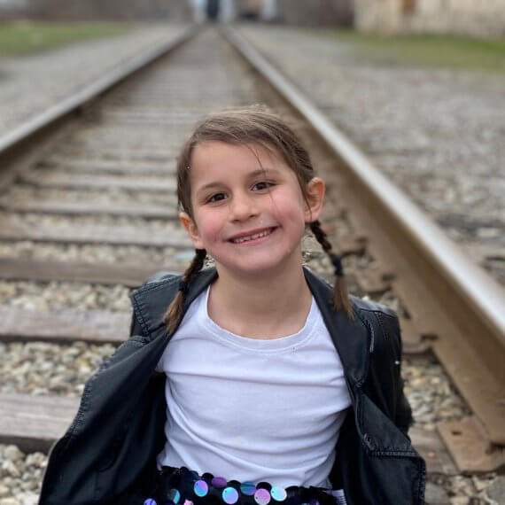 Look #7 Playful Glitter Stylist: Chie Kai Outfit: Mini spangle skirt, White shirtLeather jacket Shoes: Personal Collection Model: Evelyn Mager Photographer: Krysia Mager Location: Batavia, NY