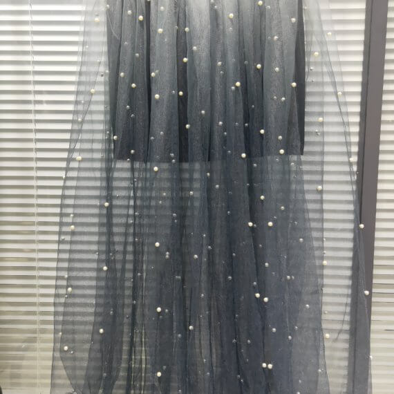 This dress is a black silk satin sleeveless mandarin collared halter shift dress with a white to black ombre silk chiffon pearl beaded long skirt.