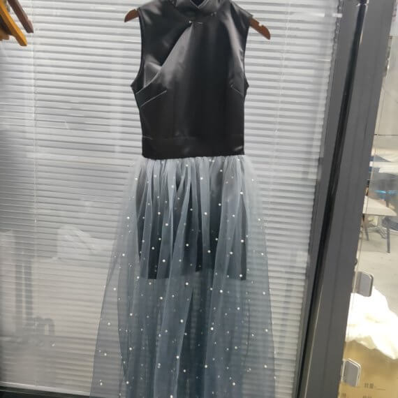 This dress is a black silk satin sleeveless mandarin collared halter shift dress with a white to black ombre silk chiffon pearl beaded long skirt.