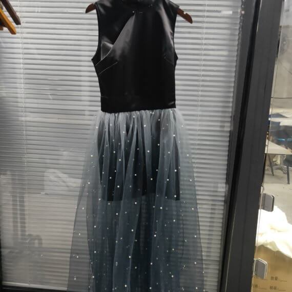 This dress is a black silk satin sleeveless mandarin collared halter shift dress with a white to black ombre silk chiffon pearl beaded long skirt.